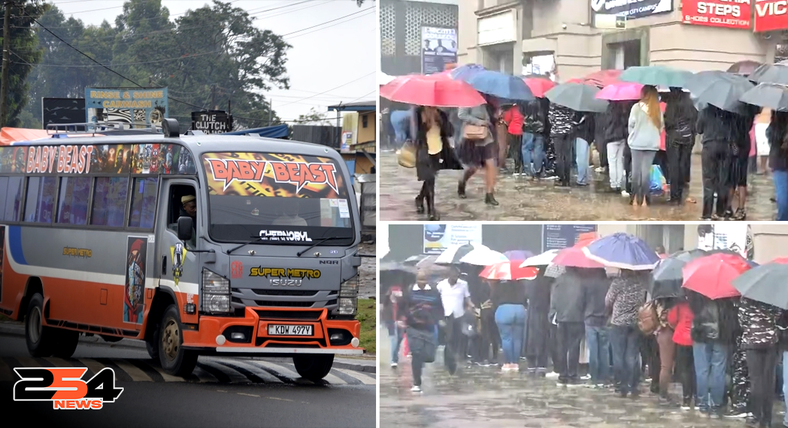 Nairobi commuters queue in heavy rain waiting to board a Super Metro bus.