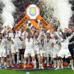 Aston Villa's Scottish midfielder #07 John McGinn and his teammates celebrate with the trophy after winning the UEFA Europa League final football match between SC Freiburg and Aston Villa at Besiktas Park in Istanbul on May 20, 2026. (Photo by Stefano RELLANDINI / AFP)