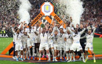 Aston Villa's Scottish midfielder #07 John McGinn and his teammates celebrate with the trophy after winning the UEFA Europa League final football match between SC Freiburg and Aston Villa at Besiktas Park in Istanbul on May 20, 2026. (Photo by Stefano RELLANDINI / AFP)