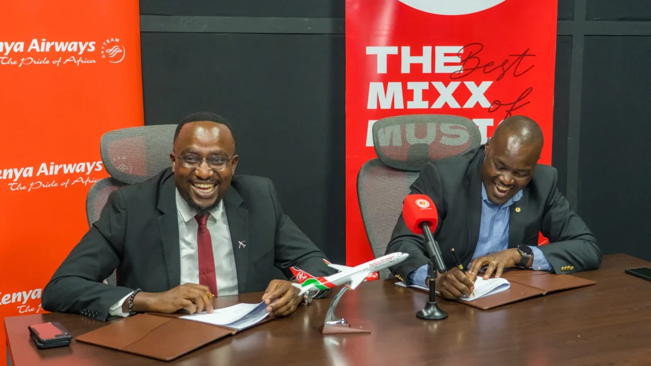 Kenya Airways’ Martin Gitonga, left, and Capital FM’s Symon Bargurei at the partnership signing